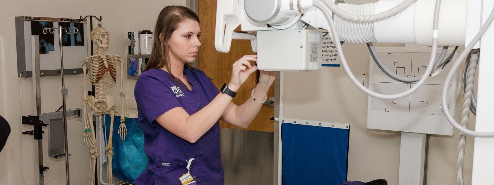 radiography student practices with MRI machine