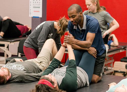 physical therapy students practice exercises